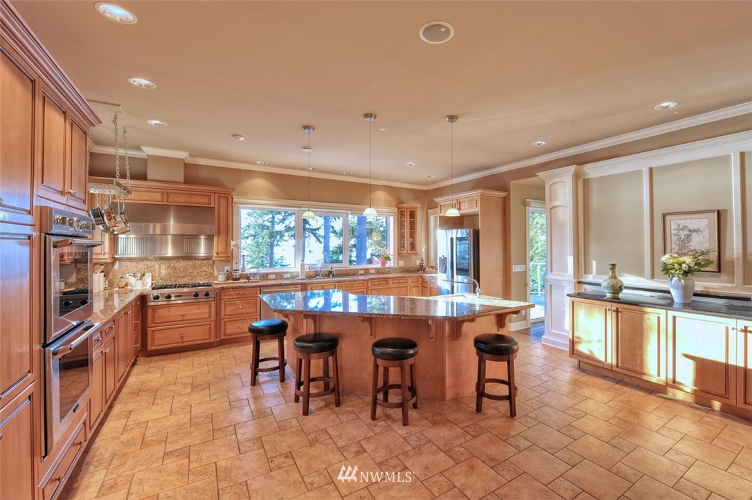 732 Fieldston Road Bellingham, WA 98225 - Photo 9 of 25 a large kitchen with lots of counter and chairs