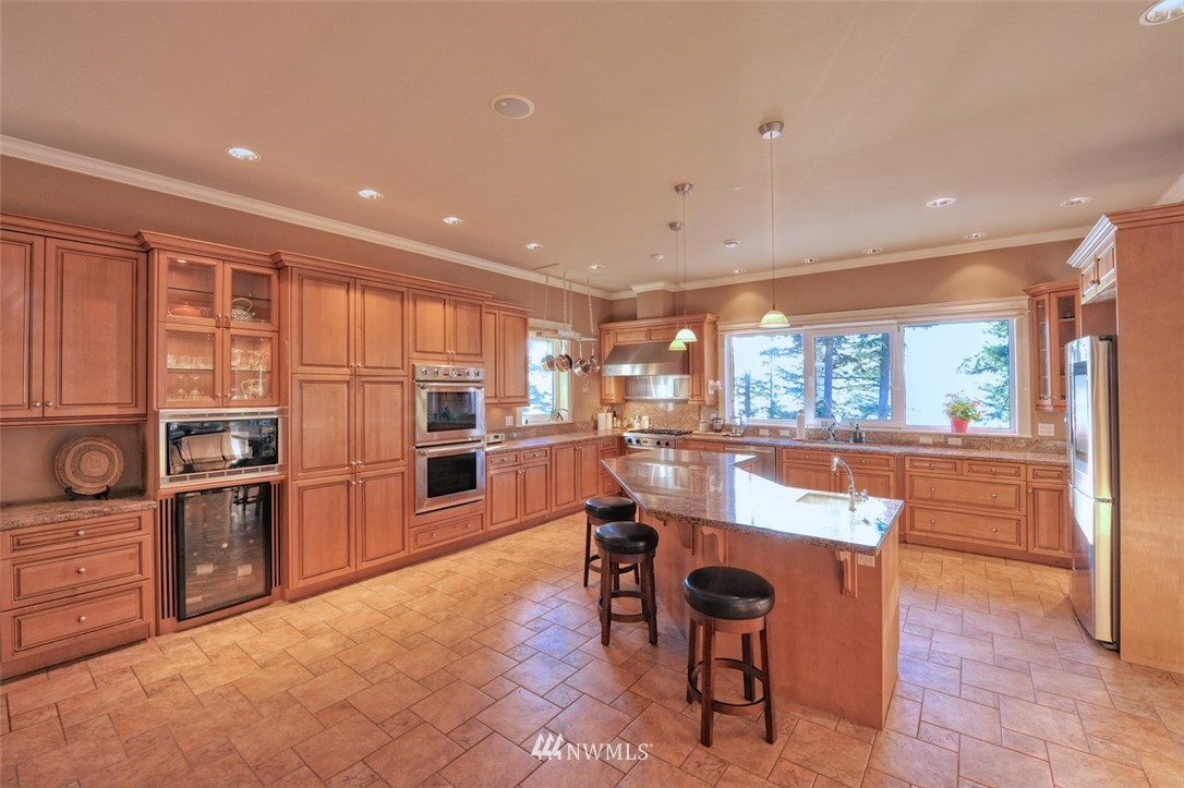 732 Fieldston Road Bellingham, WA 98225 - Photo 10 of 25 a kitchen with counter top space cabinets and stainless steel appliances