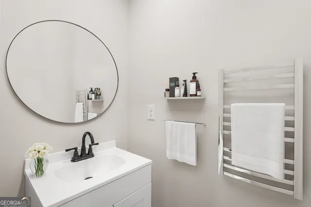 a bathroom with a sink and a mirror
