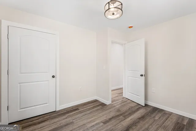 an empty room with wooden floor