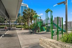 88 Southwest 7th Street, Unit 2210 Miami, FL 33130 - Photo 22 of 24 Outdoor play area on the amenity deck with Brickell skyline views.