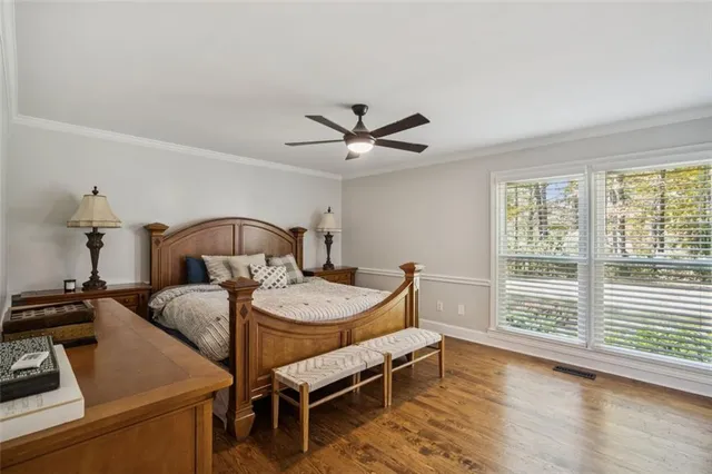 a bedroom with furniture and a window