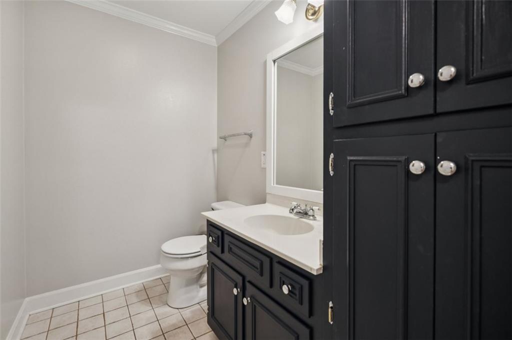 1173 Antioch Campground Road Gainesville, GA 30506 - Photo 13 of 23 a bathroom with a sink a toilet and mirror