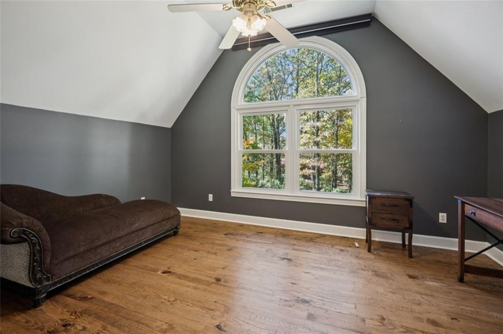 1173 Antioch Campground Road Gainesville, GA 30506 - Photo 14 of 23 a living room with a bed furniture and a window