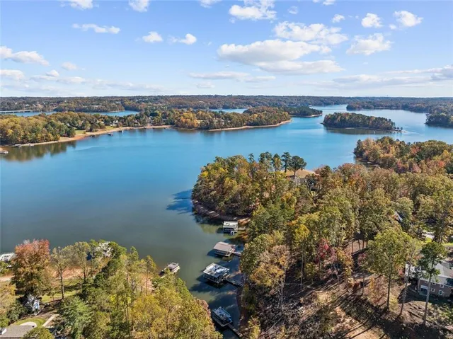 an aerial view of a houses with ocean view