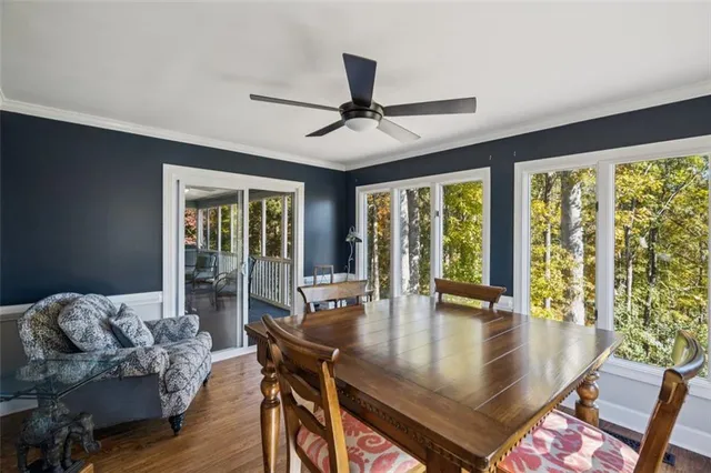 a view of a dining room with furniture window and wooden floor