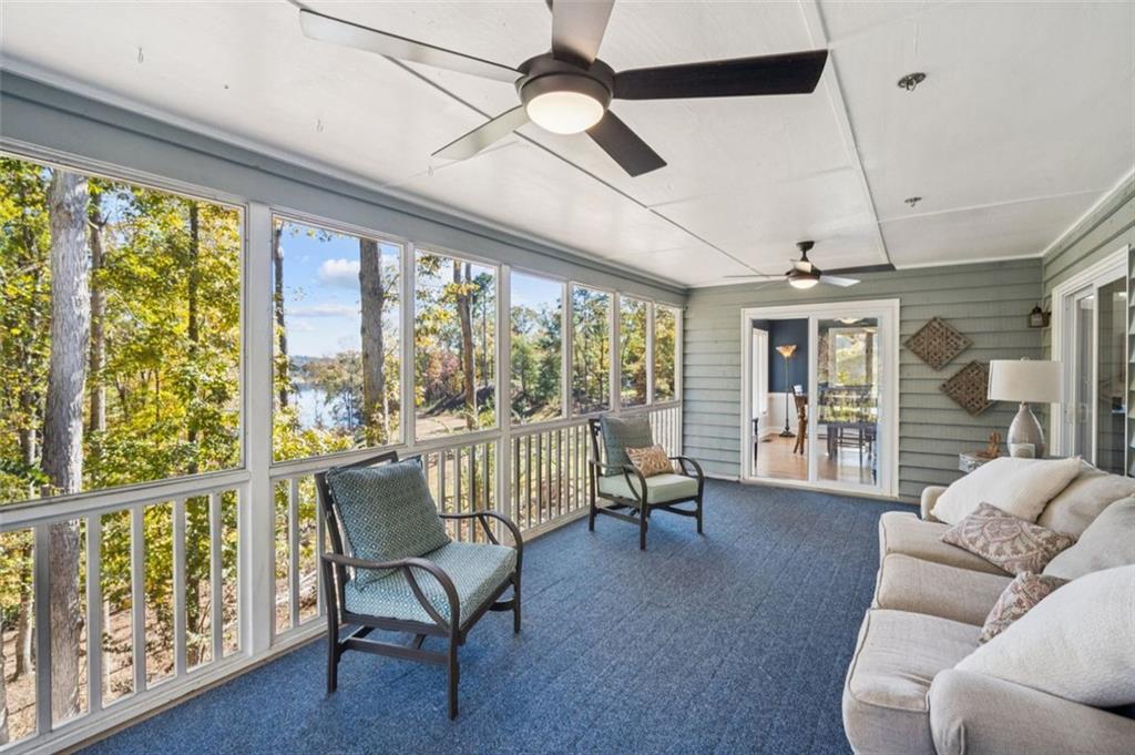 1173 Antioch Campground Road Gainesville, GA 30506 - Photo 10 of 23 a living room with furniture and a floor to ceiling window