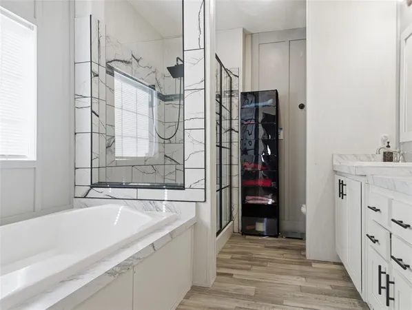 a bathroom with a bathtub and a sink