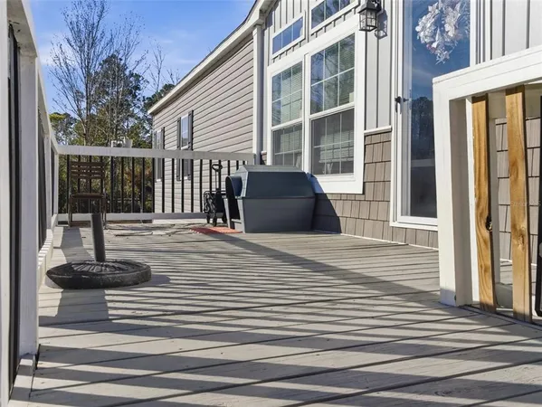 a view of a house with wooden floor and floor to ceiling windows