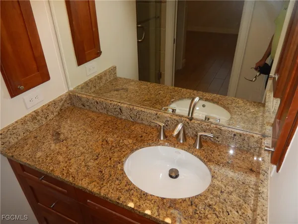 a bathroom with a sink and a mirror