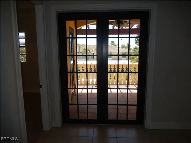 a view of a street with wooden fence