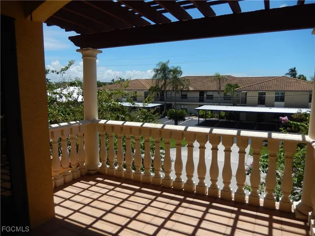 a view of balcony with wooden floor