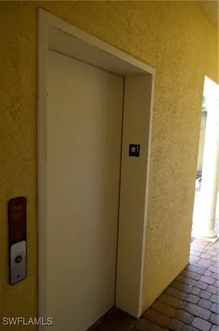 a kitchen with granite countertop a stove and a refrigerator