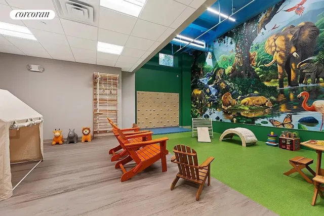 a view of a room with a table and chairs