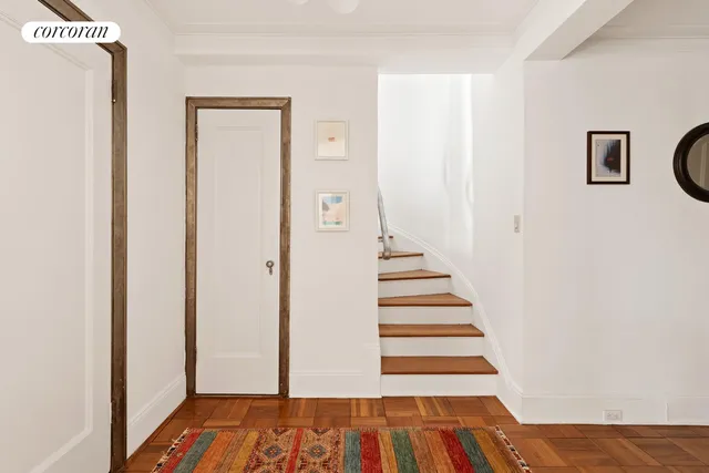 a kitchen with a sink a stove and chairs