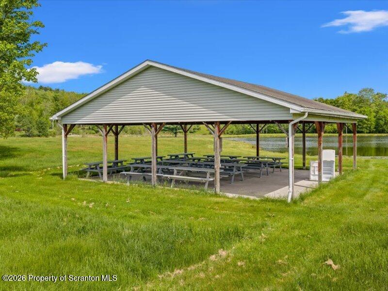 9-17 Vago Road Tunkhannock, PA 18657 - Photo 42 of 57 a backyard of a house with table and chairs