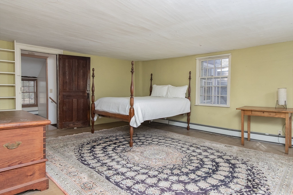 436 Main Street Groton, MA 01450 - Photo 26 of 39 a bedroom with a bed and a window