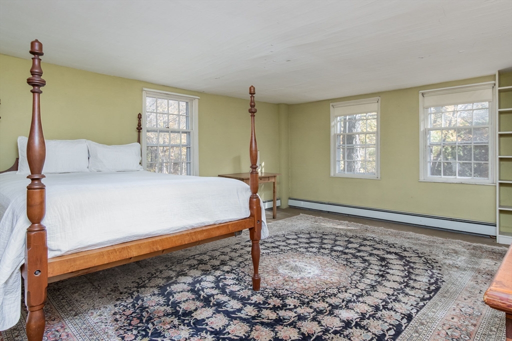 436 Main Street Groton, MA 01450 - Photo 27 of 39 a bedroom with a bed and a window