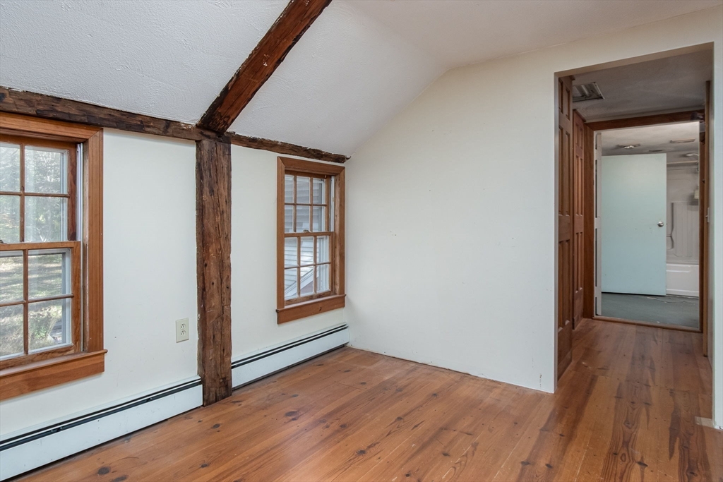 436 Main Street Groton, MA 01450 - Photo 28 of 39 an empty room with wooden floor and windows