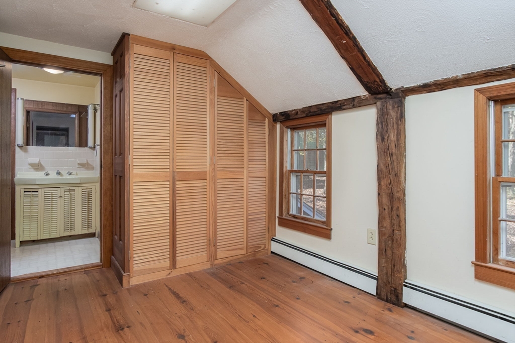 436 Main Street Groton, MA 01450 - Photo 29 of 39 a view of a hallway with wooden floor and cabinet