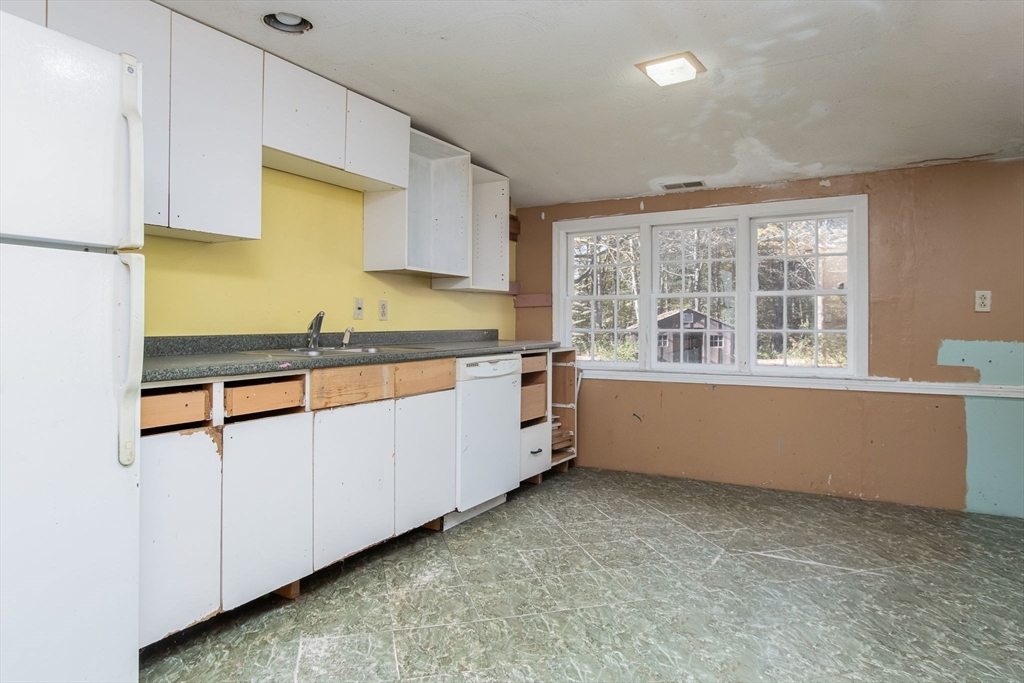 436 Main Street Groton, MA 01450 - Photo 32 of 39 a kitchen with counter top space and windows