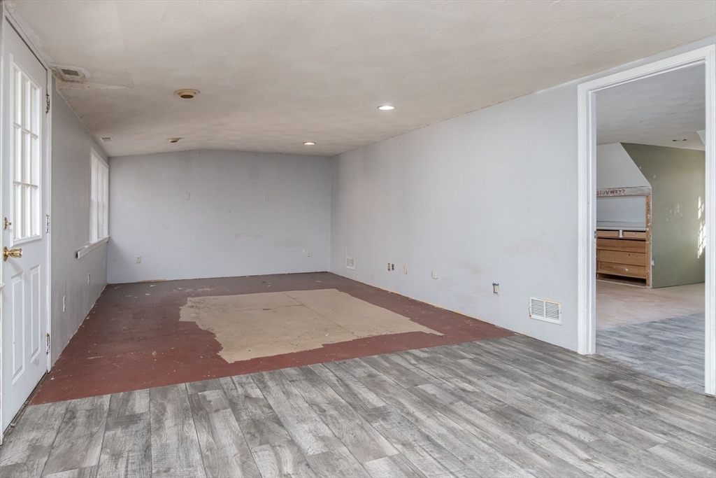 436 Main Street Groton, MA 01450 - Photo 35 of 39 an empty room with wooden floor and windows