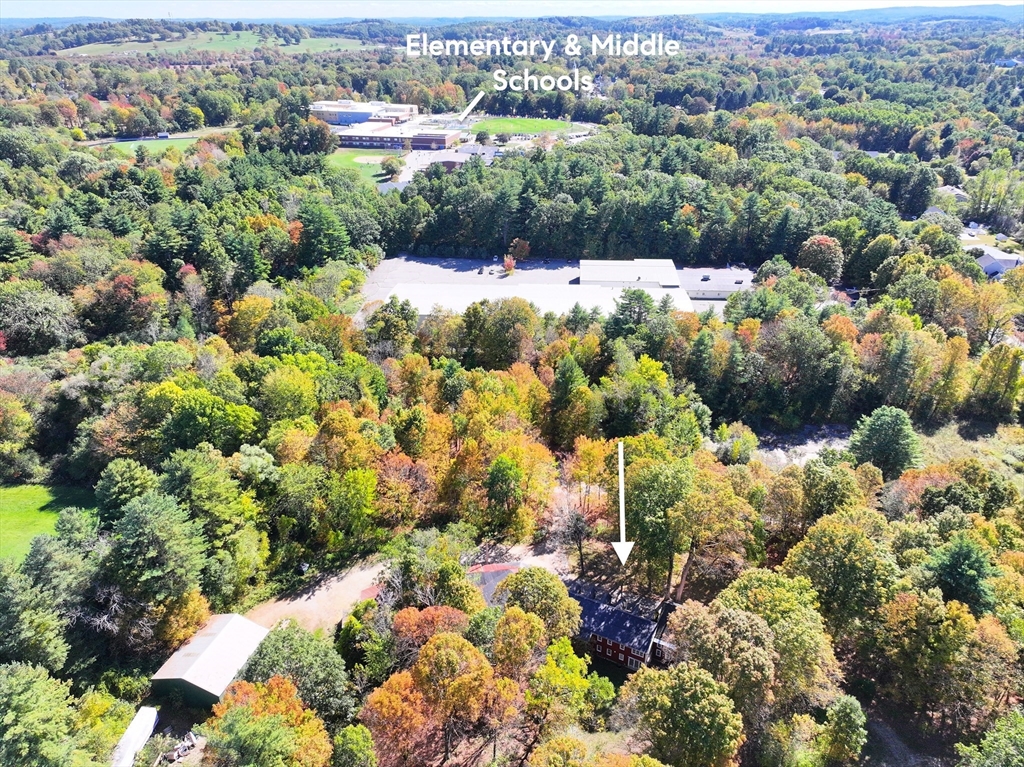 436 Main Street Groton, MA 01450 - Photo 4 of 39 a view of a lot of trees and houses