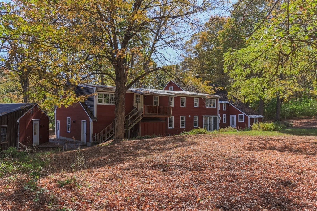 436 Main Street Groton, MA 01450 - Photo 6 of 39 a view of a house with a yard