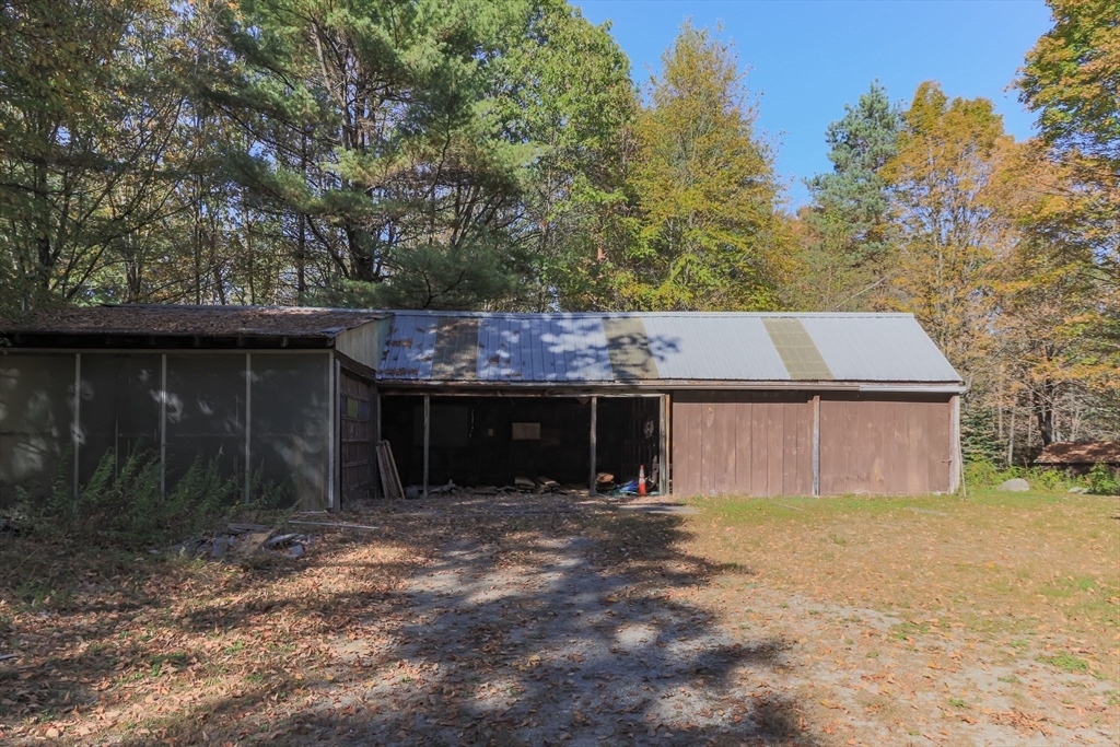 436 Main Street Groton, MA 01450 - Photo 7 of 39 a front view of house with yard and trees in the background