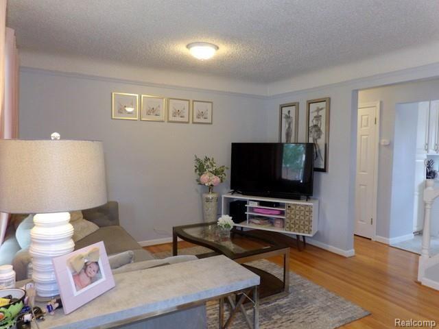 7911 Merrick Street Taylor, MI 48180 - Photo 12 of 42 12. LIVING ROOM FEATURES BEAUTIFUL HARDWOOD FLOORS!