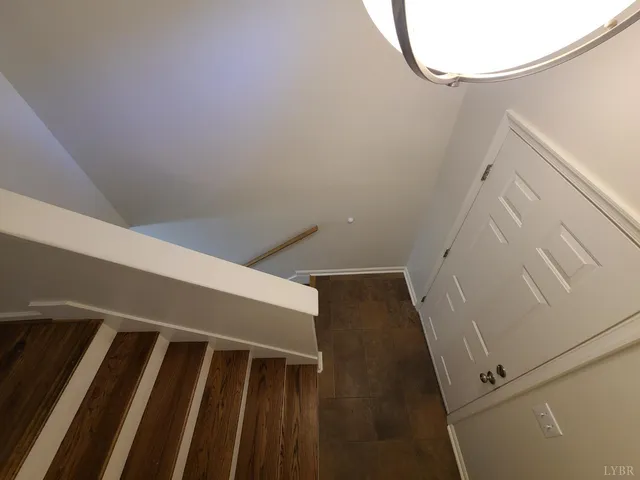 a view of staircase with white walls