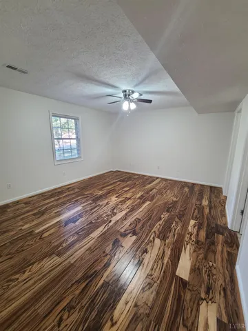 a view of a big room with wooden floor