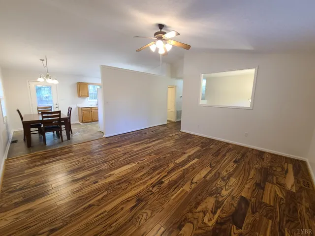 a view of a livingroom with furniture nad wooden floor