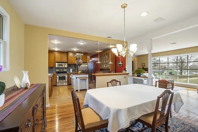 a large kitchen with a table and chairs