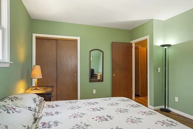 a bedroom with a bed and bathroom