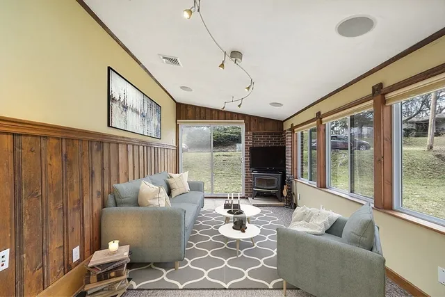 a living room with furniture and a large window