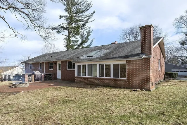 a house that has a tree in front of it