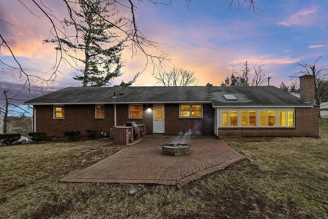 a front view of a house with yard