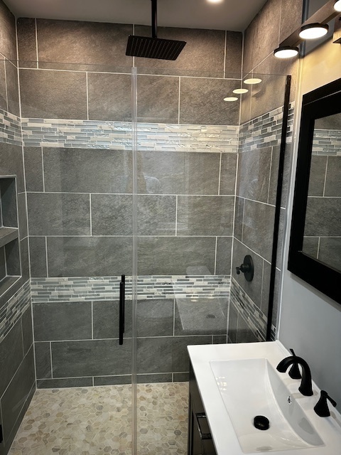 3746 North Whipple Street, Unit 2 Chicago, IL 60618 - Photo 12 of 22 a bathroom with a sink and a shower