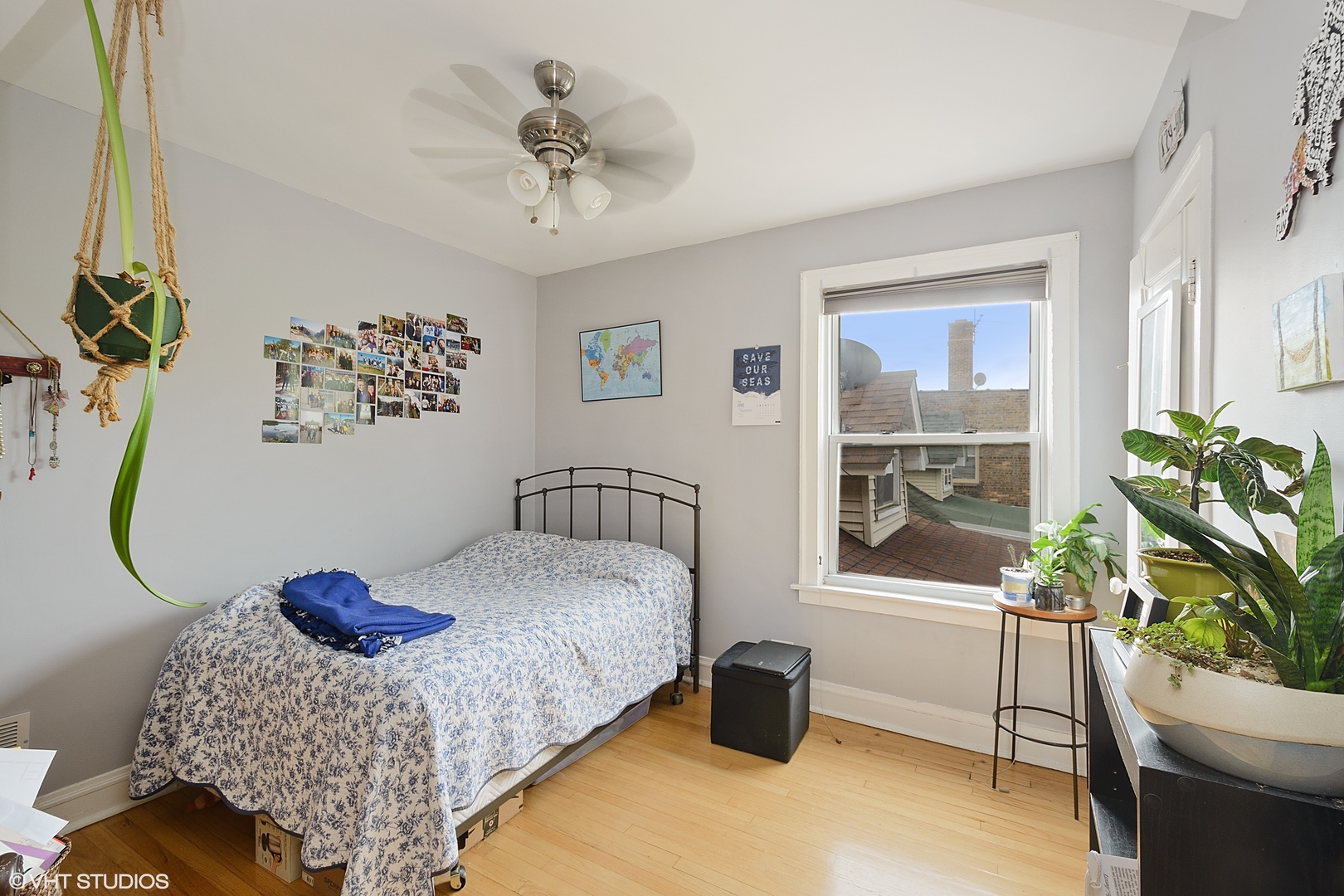 3746 North Whipple Street, Unit 2 Chicago, IL 60618 - Photo 15 of 22 a bedroom with a bed potted plant and a window