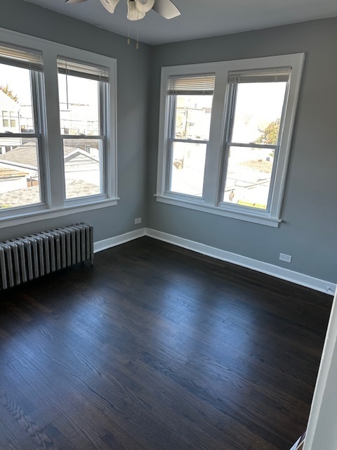 3746 North Whipple Street, Unit 2 Chicago, IL 60618 - Photo 17 of 22 a view of an empty room with wooden floor and a window