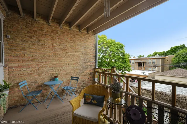a view of balcony with furniture