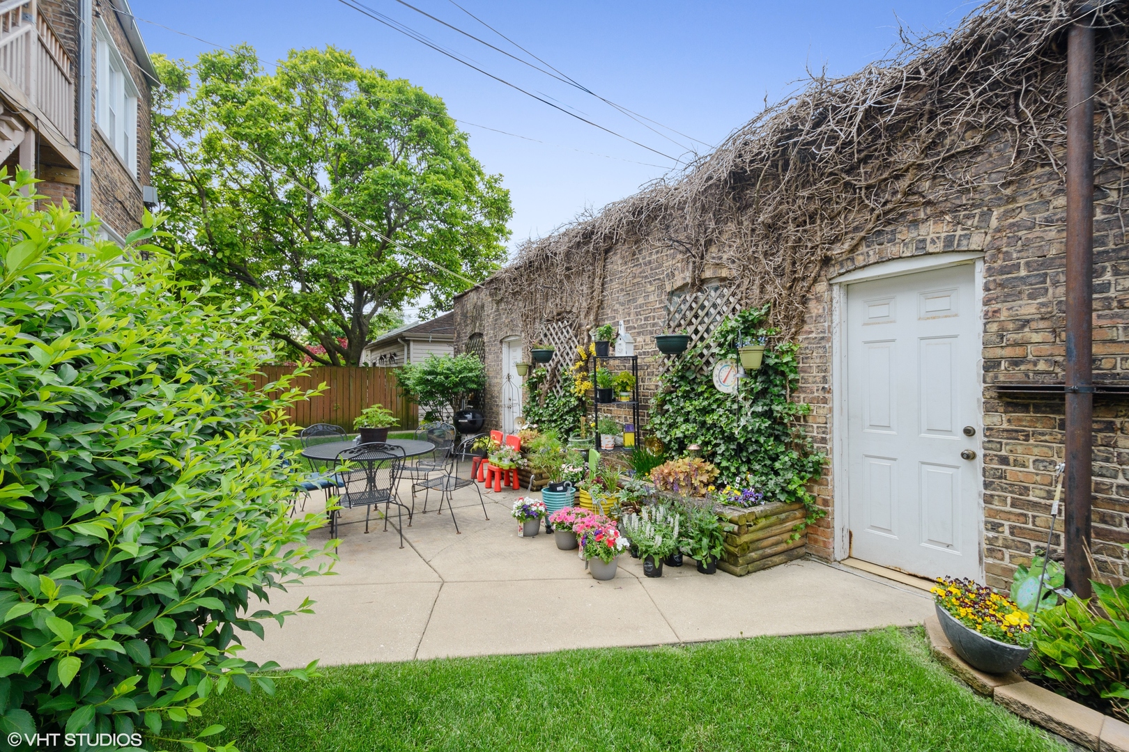 3746 North Whipple Street, Unit 2 Chicago, IL 60618 - Photo 21 of 22 a view of a chair and table in backyard of the house