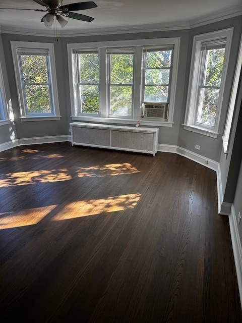 3746 North Whipple Street, Unit 2 Chicago, IL 60618 - Photo 5 of 22 a view of an empty room with wooden floor and a window