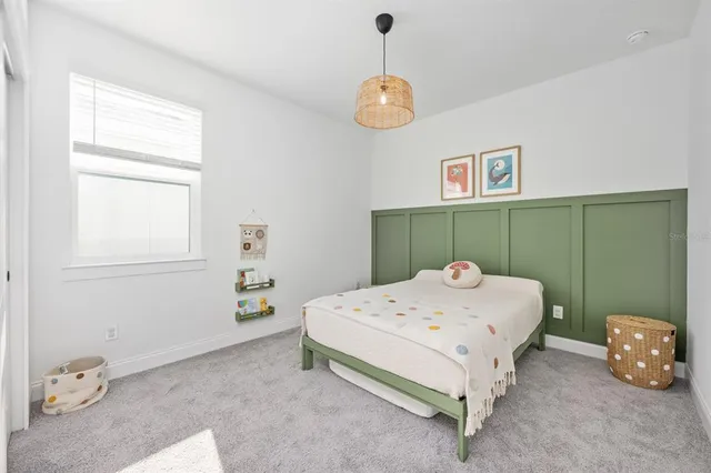 a bathroom with a double vanity sink toilet and a mirror