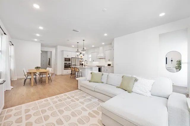 a living room with furniture and a table