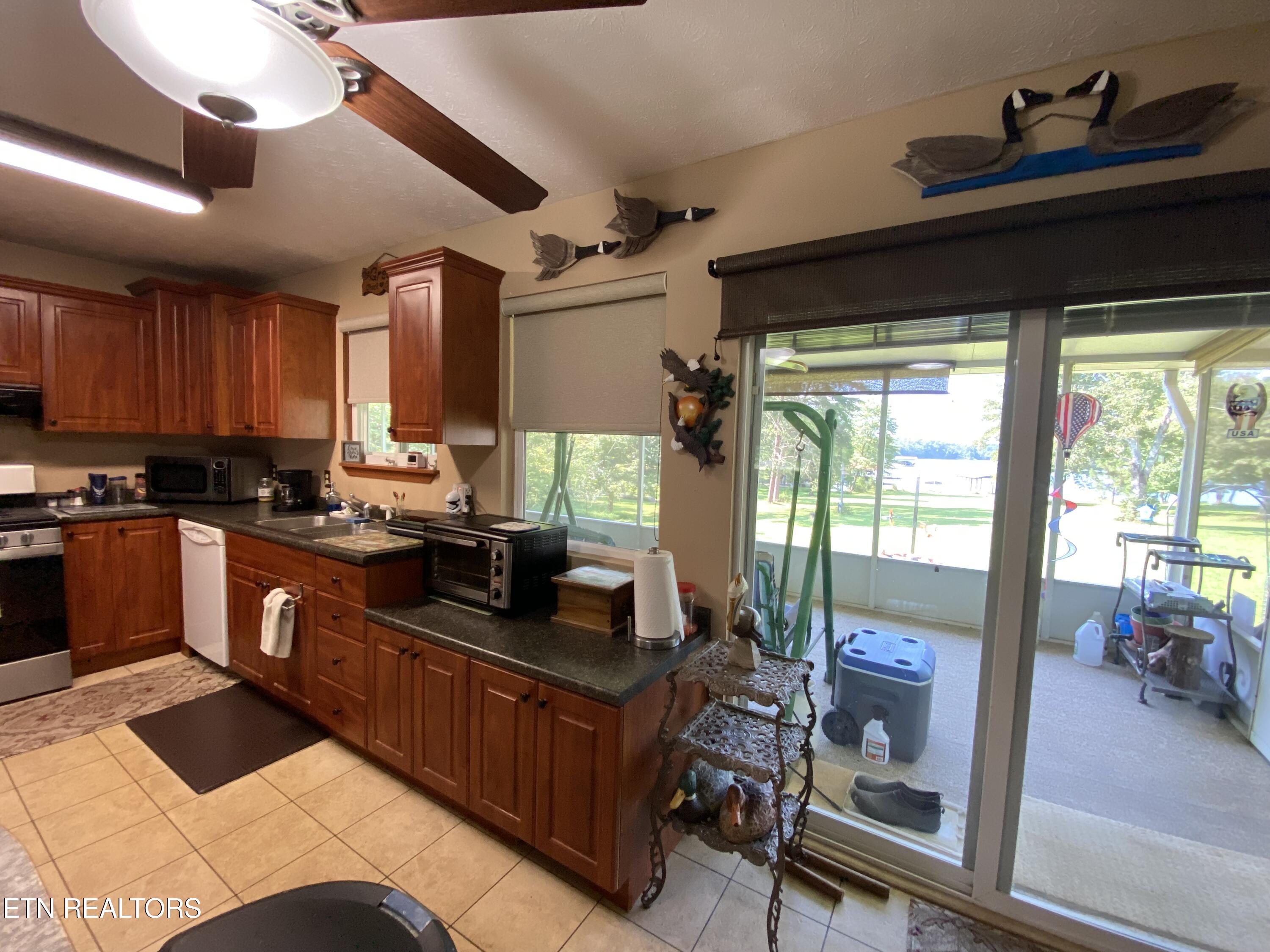 886 Pin Hook Road Spring City, TN 37381 - Photo 12 of 30 Kitchen to Screened Porch