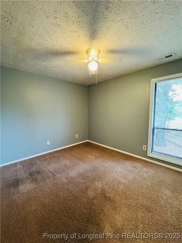 an empty room with a empty space and a window