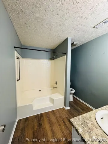 a bathroom with a sink and a shower