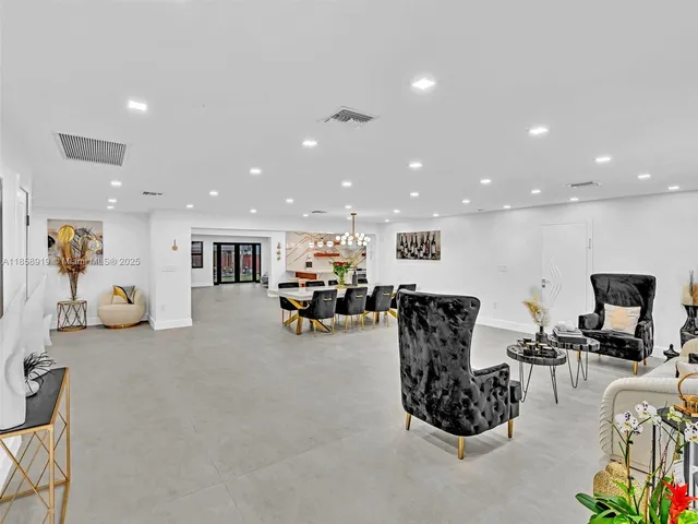 a kitchen with granite countertop a sink and a stove top oven